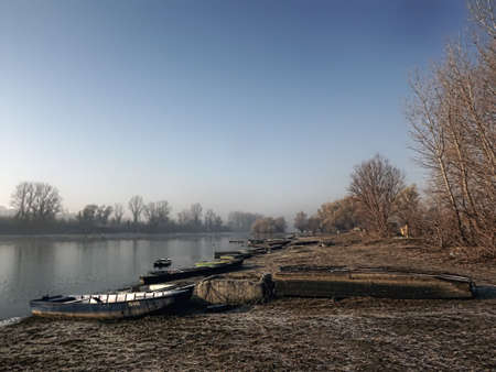 A forgotten fishing boat in the tributary of the Danube near Novi Sad, Serbia.の写真素材