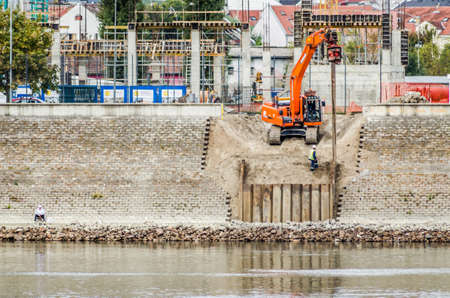 Novi Sad, Serbia - September 29. 2019: Petrovaradin suspicion by the river Danube. Working machines on the shores of the Danube River.のeditorial素材