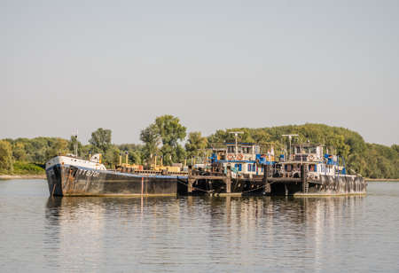Anchored Tankers on the Danube River in Petrovaradin near the city of Novi Sad.のeditorial素材