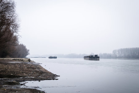 Tankers on the Danube River during the winter period. Anchored tankers on the Danube River in winter.の写真素材