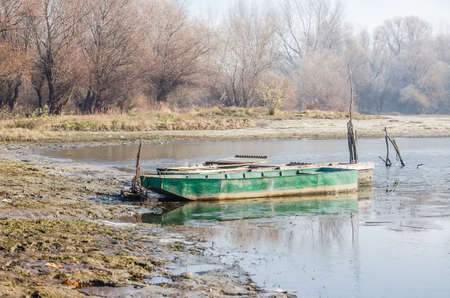 Danube Island Sodros near Novi Sad, Serbia. Gray and white landscape with snow covered trees and frozen water.の写真素材