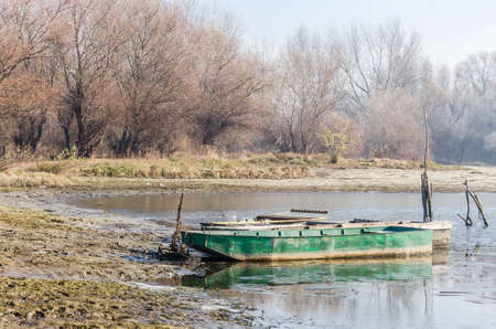 Danube Island Sodros near Novi Sad, Serbia. Gray and white landscape with snow covered trees and frozen water.の写真素材