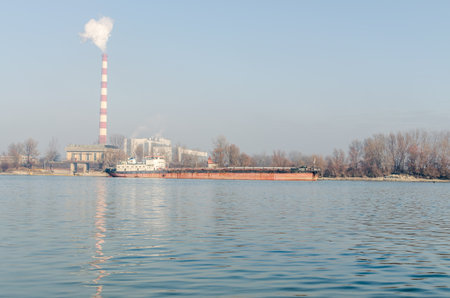 Anchored tankers with waste material. Anchored tankers with loaded waste material on the Danube River.の写真素材