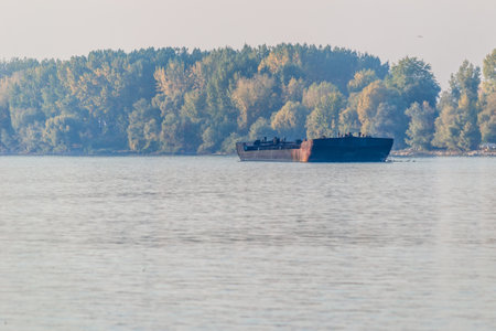Anchored tankers on the Danube River. A view of the anchored tankers on the Danube River near Novi Sad in an autumn setting.の写真素材