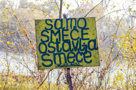 Wooden warning sign, at the entrance to the forest.の写真素材