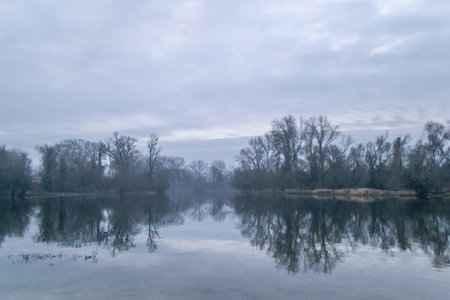 The lake in winter in the morning. Lake landscape in winter in the morning.の写真素材