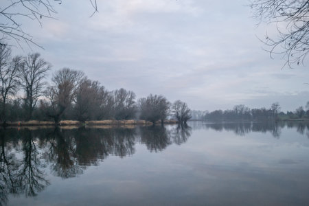 The lake in winter in the morning. Lake landscape in winter in the morning.の写真素材