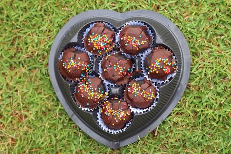Choc ball on the green grass in the football.の写真素材