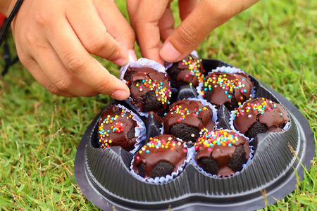 Children are taken in hand sweets to eat.