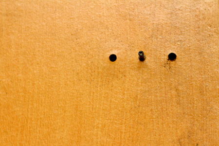 Used tack stitching on the floor a wooden board.の写真素材