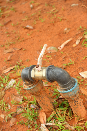 A water pipes on the green grassの写真素材