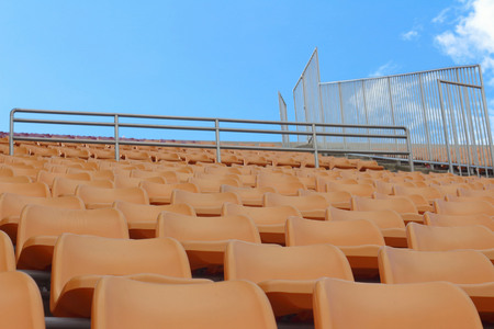 Seat of grandstand in an empty stadiumの写真素材