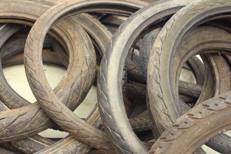used car tires put a pile on the floor.の写真素材