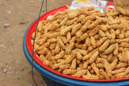 Boiled peanuts in tray at the marketの写真素材