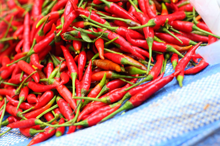 Red chilli on a tray at the marketの写真素材