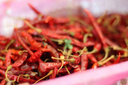 Red chilli on a tray at the marketの写真素材