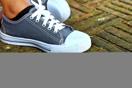 Gray shoes on the background of the floor.