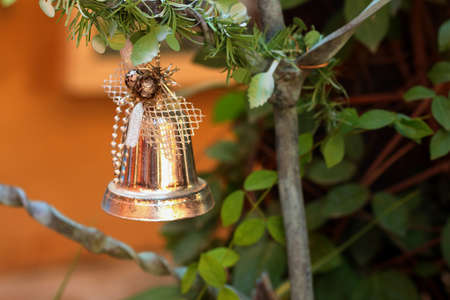 A silver bell on the Christmas tree.の写真素材