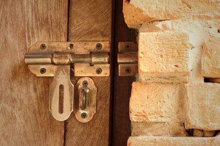 lock of the door locked with padlock.の写真素材