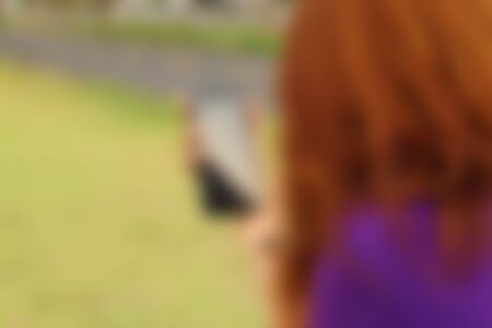 blurred of women  is using a phoneの写真素材
