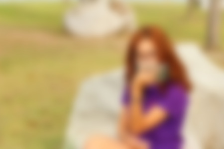 blurred of women  is using a phoneの写真素材