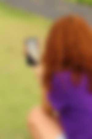 blurred of women  is using a phoneの写真素材
