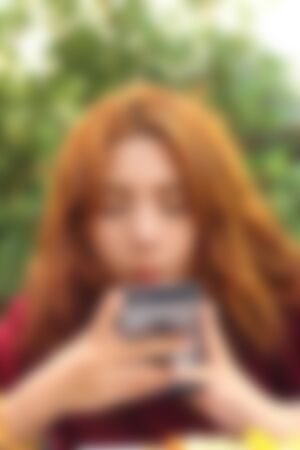 blurred of women  is using a phoneの写真素材