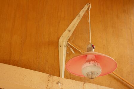 Wall lamp on an orange background at the parkの写真素材