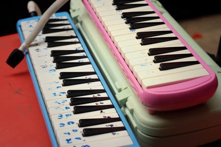 musical instrument melodion on a brown table.