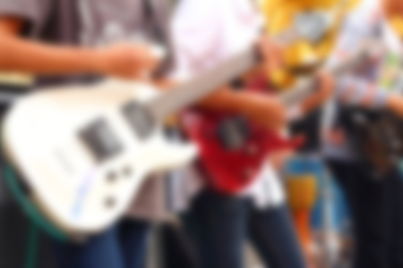 blurred image of guitarists playing guitar.の写真素材