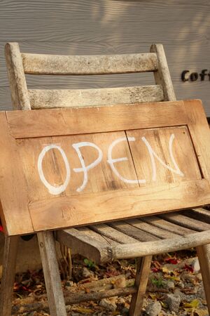 Signs symbolize open on a wood backgroundの写真素材