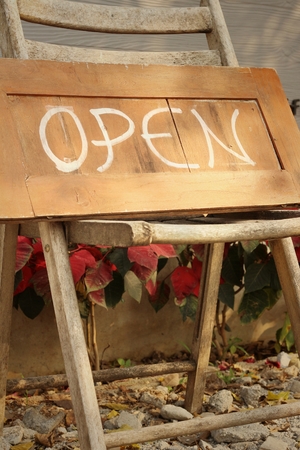 Signs symbolize open on a wood backgroundの写真素材