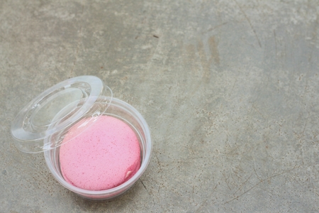 Macaron in the box on the background of the cement.の写真素材