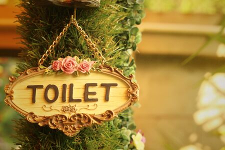 toilet vintage label on a brown background.の写真素材