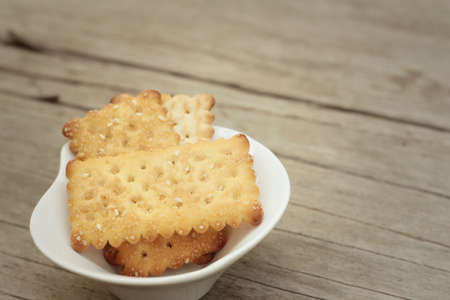 Tasty of crackers on a wood tableの写真素材