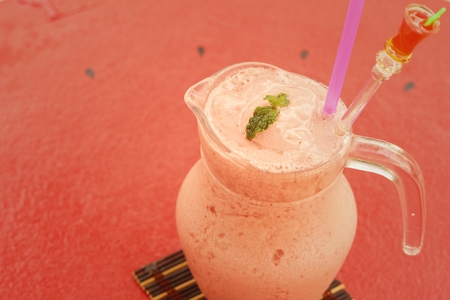 Fruit smoothies in glass placed in the garden.の写真素材