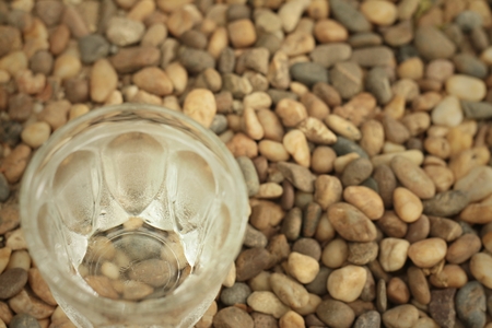 Water in a glass on a background of rock.の写真素材