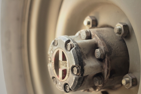 Old truck wheel of a car on the road.の写真素材