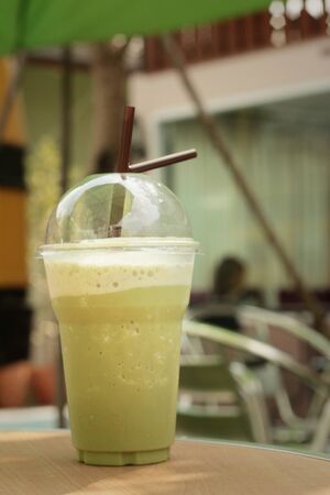Iced green tea on a table in the garden.の写真素材