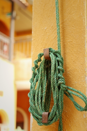 Green rope was tied to a pole.の写真素材