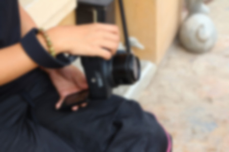 Blurred image of a woman taking photoの写真素材