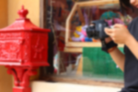 Blurred image of a woman taking photoの写真素材