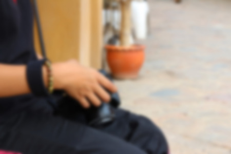 Blurred image of a woman taking photoの写真素材