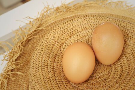 eggs on a background of brown hat.の写真素材