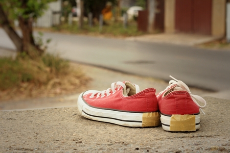 Red shoes on the floor of cement.の写真素材