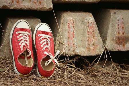Red shoes on the floor of cement.の写真素材