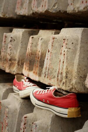 Red shoes on the floor of cement.の写真素材