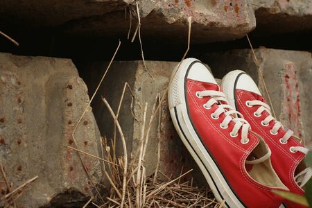 Red shoes on the floor of cement.の写真素材