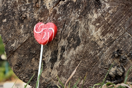 Candy valentines hearts on a background of wooden.の写真素材