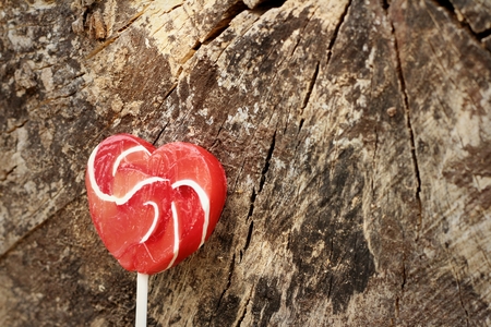 Candy valentines hearts on a background of wooden.の写真素材